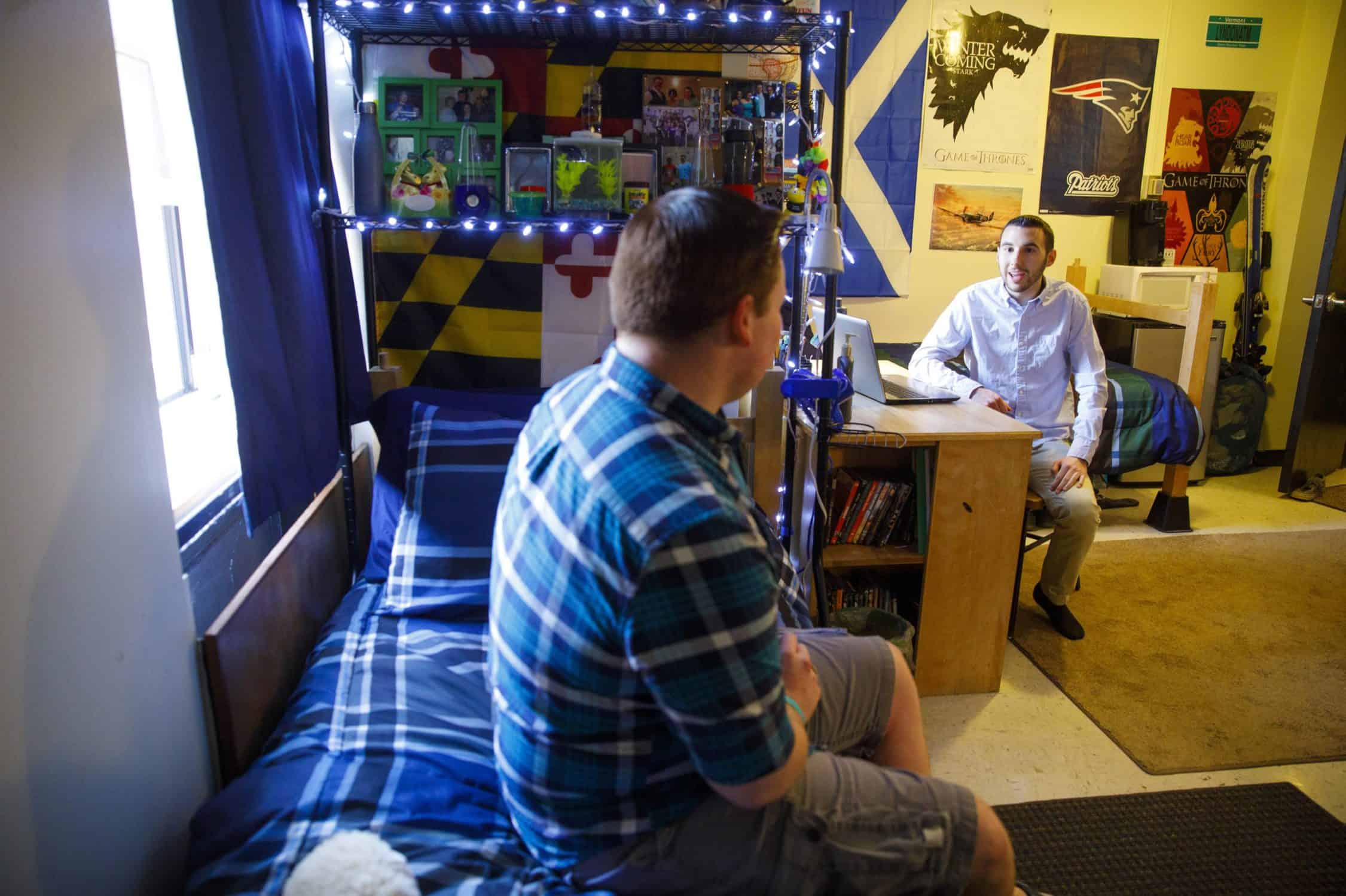 Two students in a residence hall room