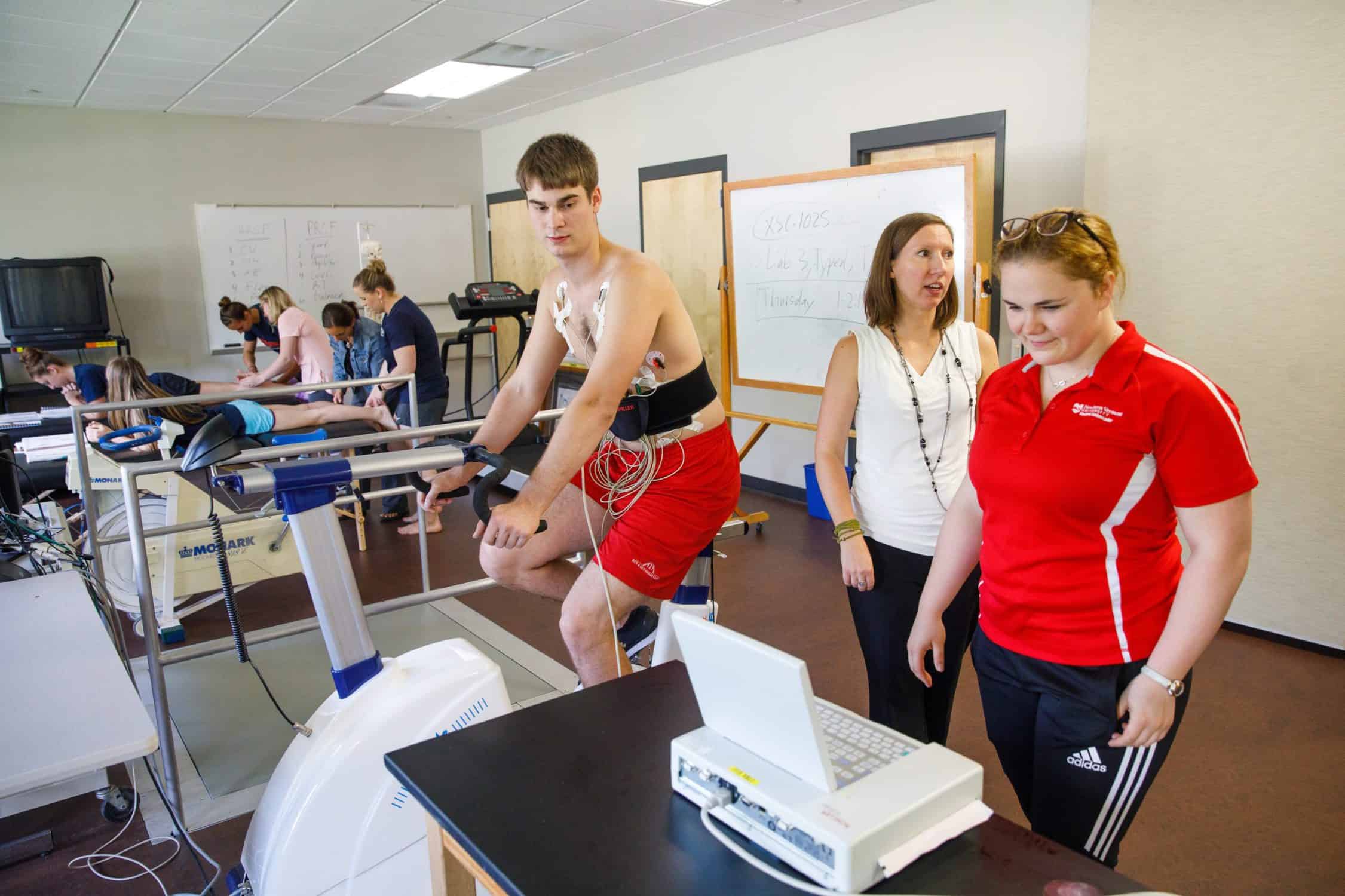 Student is examined by another student while he exercises