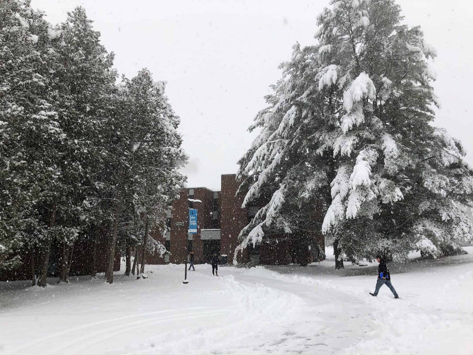 Students walk to class on a snowy day