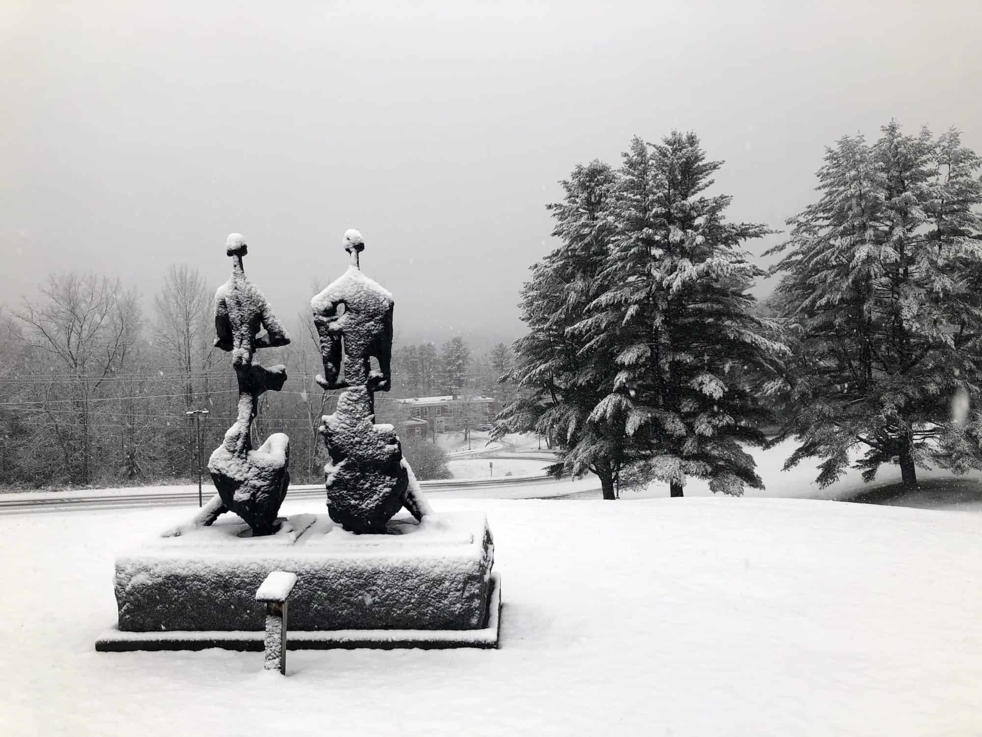 Statues are covered in snow